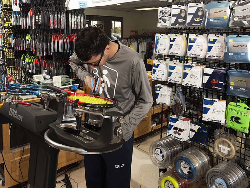 Stringing a tennis racket